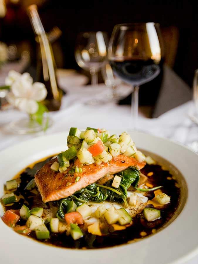 Fine dining salmon dish served through the Segreto Del Lusso concierge service