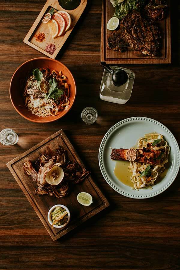 Gourmet dishes on wooden boards prepared by a private chef in Zakynthos