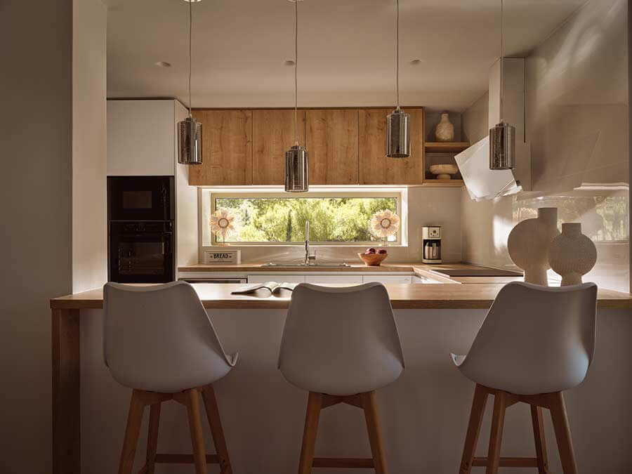 Kitchen island with bar stools in the villa kitchen at Segreto Del Lusso, Zakynthos