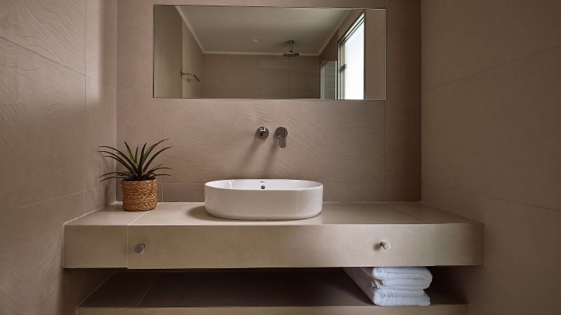 Bathroom with stone washbasin and mirror – Segreto Del Lusso, Zakynthos